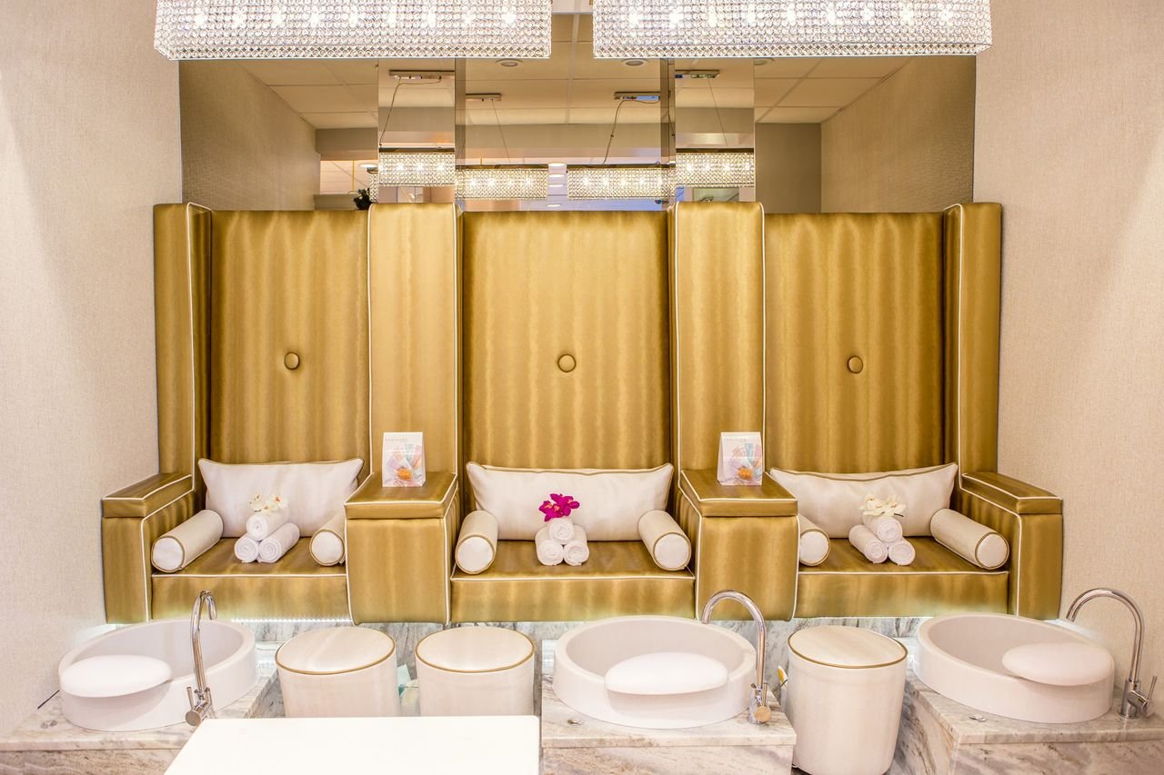 Services Elegant and contemporary spa interior featuring luxurious pedicure stations for relaxation.